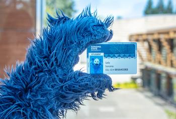 Lobo holding student id